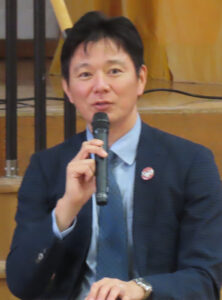 実行委員で現PTA会長の福永さんも地域のボランティアによる見守り活動への感謝の言葉を述べ、保護者たちも自らが手を挙げて子どもたちの見守りや活動へのサポートを行うことの大切さを呼び掛けていました